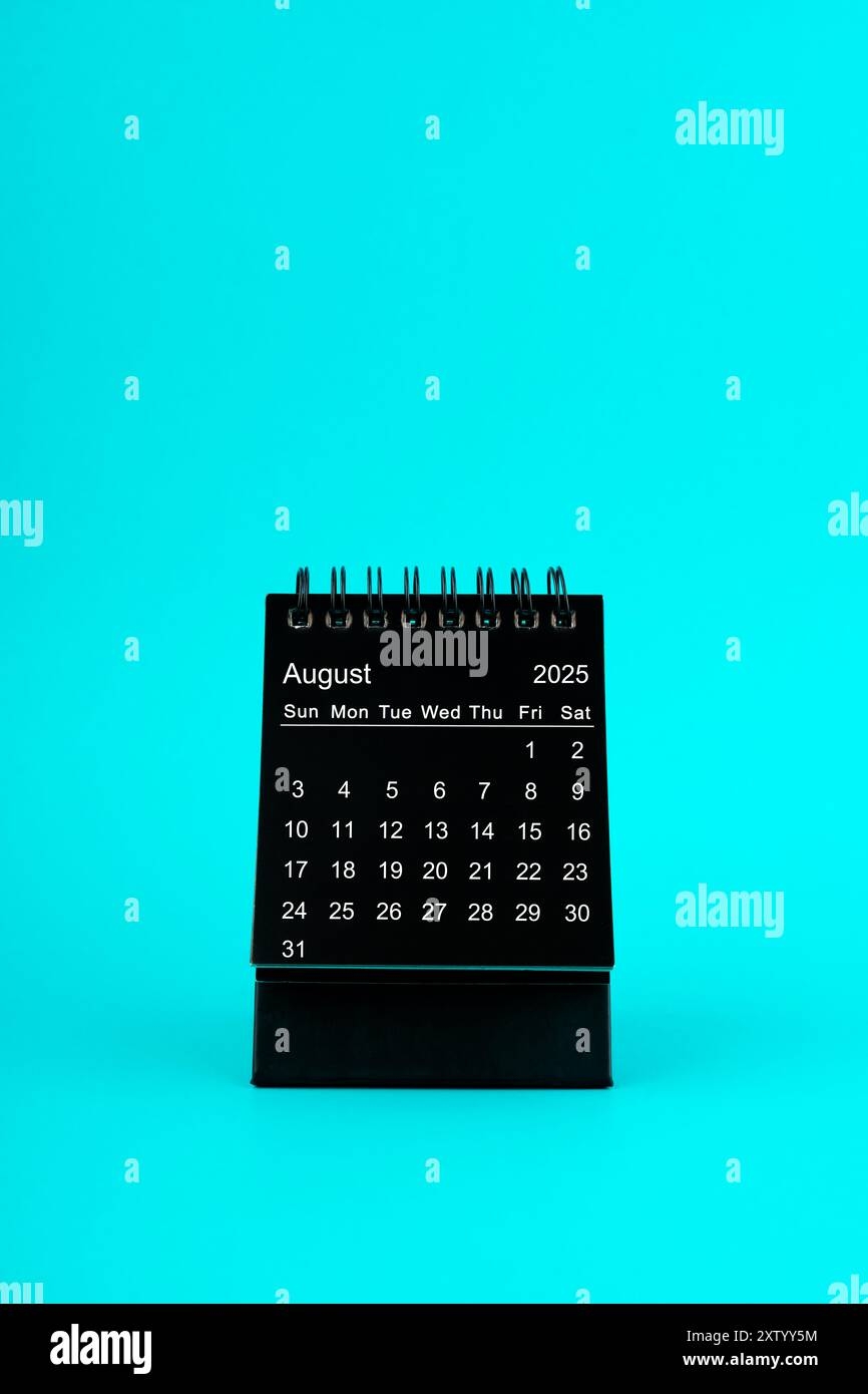 Black Calendar For August 2025 Desktop Calendar On A Green Color Background Stock Photo Alamy